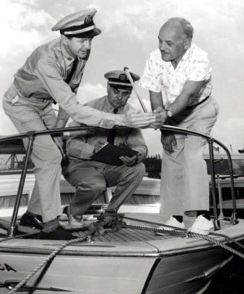 While the uniforms may have changed since the 1950s, the Coast Guard Auxiliary is still providing free Vessel Safety Checks for recreational boaters. The CG Auxiliary checks all the items required by federal and state regulations and provides the owner with a list of items that should be fixed; vessels that pass are given a decal that indicates all required items to be in compliance at the time of the inspection. Courtesy photo