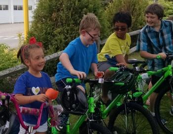 Southport Central School students, from left, Sarah Harris, Corey Sherman, Rafael Goldhirsch and Nathan Rideout rejoice over receiving their new bicycles from the Masons. Other kids who received bikes for reading books were Madison Hughes, Alex Heil, Azalea Bennett, Journey Bennett, Fox Elder, Ronan Cullina, Teal Beavis and Lilly Burnham. Courtesy of Eileen Higgins