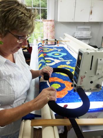 Deb Boucher works on a quilt for a client. SUZI THAYER/Boothbay Register