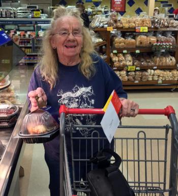 Ramona Gaudette of Southport picked up a roast chicken during the grand reopening of Boothbay Harbor Hannaford on June 13. SUZI THAYER/Boothbay Register