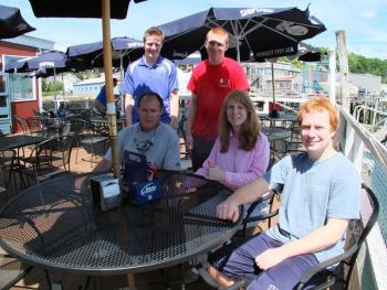 The Miller family, who have taken over Lobsterman’s Wharf in East Boothbay, enjoy a moment of family time on the deck of their new restaurant. Seated, from left, are Dan, Eileen and Zach. Standing are, from left, Killian and Cormac. SUZI THAYER/Boothbay Register