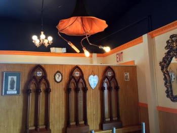 The four ceiling lights in Van Lloyd Bistro’s dining room are old Victrola horns that have been transformed into hanging art by the couple. SUZI THAYER/Wiscasset Newspaper