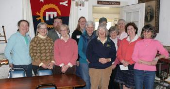 Barbara Rumsey (front, dark jersey) is surrounded by Boothbay Region Historical Society volunteers during the gathering to honor her on April 25, 2013. Courtesy of Betsy Spekke