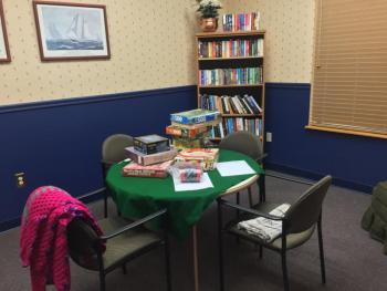 This room is set up for reading, puzzles and card playing, with lots of donated games and books. SUZI THAYER/Boothbay Register