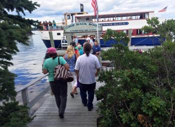 Customers head back to the Bennie Alice after their authentic Maine clambake. SUZI THAYER/Boothbay Register