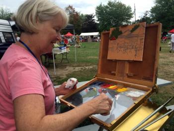 Bobbi Heath of Yarmouth was just beginning her painting that would have to be completed in two hours at the Quick Draw event at the Boothbay Common on Thursday, Sept. 10. SUZI THAYER/Boothbay Register