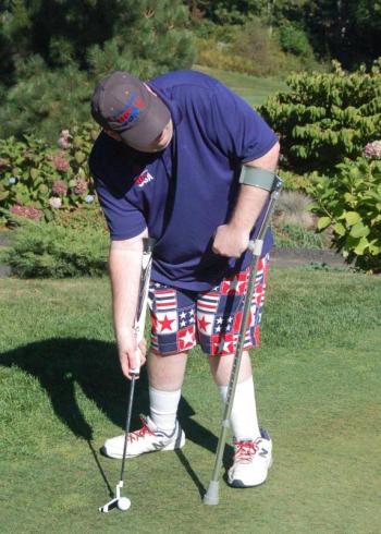Handicapped gold medal winner Scott Allen sets up a putt. ART MAYERS/Boothbay Register