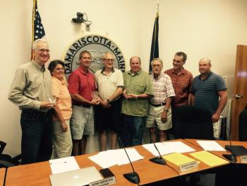 The Community Energy Fund’s three founders were awarded the Spirit of America Award from the town of Damariscotta during the Sept. 2 meeting. Pictured, from left: Charlie Ault, Selectmen’s Chairman Robin Mayer, Robert Clifford, Selectman Ronn Orenstein, Todd Maurer, Selectman George Parker, Selectman James Cosgrove and Selectman Joshua Pinkham. BEN BULKELEY/Wiscasset Newspaper