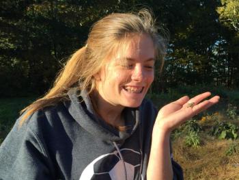 Hannah Cola holds a tiny frog and made sure to set it free away from the mayhem. KATRINA CLARK/Boothbay Register