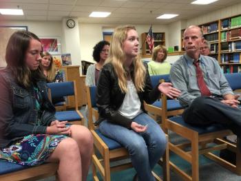 Senior Gretchen Elder, center, answered a question from BRES vice principal Tricia Campbell about her video “Dress for Success.” To her left is senior Ellie Demmons, and to her right is AP Language teacher Mark Gorey. KATRINA CLARK/Boothbay Register
