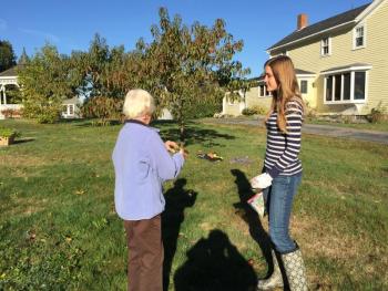 Loren Genrich, right, talks to farm owner Joan Rittall, left, about the different vegetables and what the community garden is all about. KATRINA CLARK/Boothbay Register