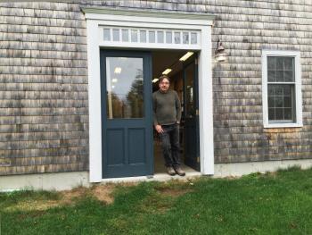 Jeff Koopus stands in the doorway of his shop on Cross Point Road in Edgecomb. SUZI THAYER/Boothbay Register