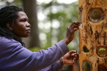 Irene Wanjiru working on a sculpture on Southport Island. The artist is the 2015 artist-in-residence of the Spillway Fund. On Oct. 17 and 18, Wanjiru’s residency will be celebrated with an exhibition. All proceeds from art sold will be donated to New Hope For Women. All photos by Robert Mitchell Irene Wanjiru