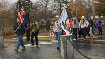BRHS Principal Dan Welch leads the students across Atlantic Avenue to the Fishermen’s Memorial for the Summit Project ceremony. KATRINA CLARK/Boothbay Register