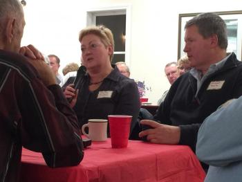 Navy Veteran Martha Cowdery speaks at the Rotary's veterans dinner as her companion Mike Tomko looks on. KATRINA CLARK/Boothbay Register