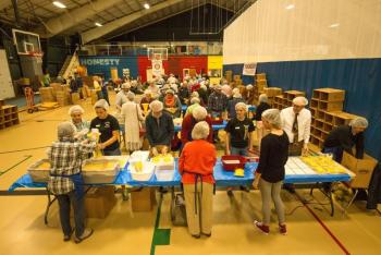 Volunteers assembling food packets for needy families Sunday at the Damariscotta YMCA at the "End Hunger in New England" event put on by the Boothbay Harbor and Damriscotta-Newcastle Rotary clubs. Courtesy of Steve Demeranville