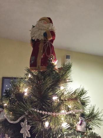 A Santa tops a lit, decorated tree in the Wiscasset Community Center lobby on Nov. 26. SUSAN JOHNS/Wiscasset Newspaper