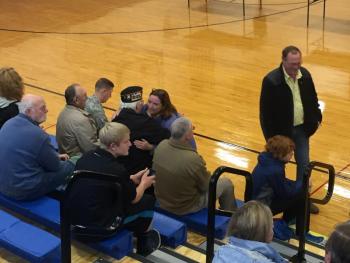 Superintendent Eileen King embraces veteran Palmer Payne before the ceremony. KATRINA CLARK/Boothbay Register