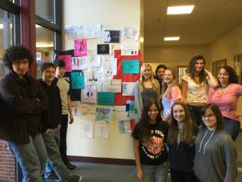 Students in one of Madame Gorey's classes stand around the artwork they helped create. From left, front row: Kylie Michael, Sierra Murray, and Isabelle Curtis; back row: William Berry, Zach Blackman, Samuel Burnham, Tayla Lewis, Rebecca Taylor, Kayla Lewis, Angie Perkins and ReAnna Heino. Not pictured: Tori Morin. KATRINA CLARK/Boothbay Register