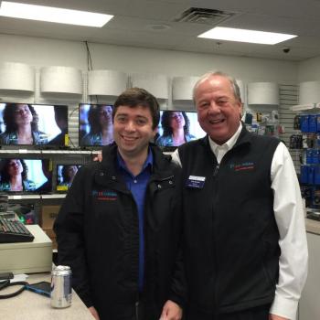 Nick Mirabile of U.S. Cellular, left, hangs out with owner Russell Brackett at Harbor-Tech Solutions during the scavenger hunt. KATRINA CLARK/Boothbay Register
