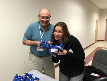Rick Gilde, Massage Therapist, with Stacy Jenkins of RHS at Business After Hours. Jenkins was giving out candy to scavenger hunters, and gave the leftovers to Jane Good at the Community Center. KATRINA CLARK/Boothbay Register