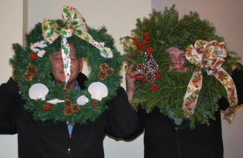 Doug Begin, left, and Gary Lawyerson show off their good fortune as drawing winners at the Christmas luncheon hosted by the St. Andrews Auxiliary for all employees of St. Andrews Village and the St Andrews Campus of LincolnHealth. Cheri Brewer, not pictured, won the centerpiece from the Village. Courtesy of Ann Kelley/St. Andrews Auxiliary