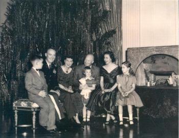 The first family 1954. President Dwight D. Eisenhower and his family were gifted with the Nativity shadowbox in the background, right, by Raymond Pitcairn who commissioned Hanna Weil Fischer Binder to carve the human figures. Courtesy of York Fischer
