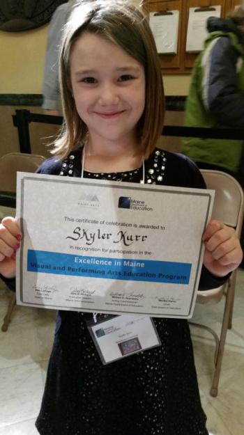 Skyler Kurr of Nobleboro Central, part of AOS 93, attended the celebration of Maine visual and performing arts in Augusta Dec. 4. Here she is with her certificate of achievement, presented by Mrs. Ann LePage. Courtesy of the DOE Skyler Kerr, Nobleboro