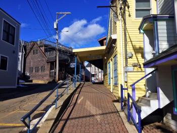 This street, the By-Way, is bustling during the summer months. Boathouse Bistro, on the left, bustles year-round. SUZI THAYER/Boothbay Register