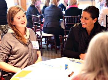 The Coulombe Center for Health Improvement held a retreat last October. Shown is a table discussion where Center Program Coordinator AnniPat McKenney listens to Erica Eames, a Boothbay Region High School student, speak about wellness in the region. Courtesy of Scott Shott