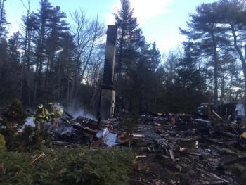 Firefighters on Friday, Feb. 26, work to put out a rekindle of a Feb. 25 fire that destroyed a Westport Island home. SUSAN JOHNS/Wiscasset Newspaper