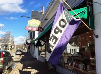 Spelled backward, even the backside of OPEN signs let people know they’re open for business! Open signs are up all over town. SUZI THAYER/Boothbay Register