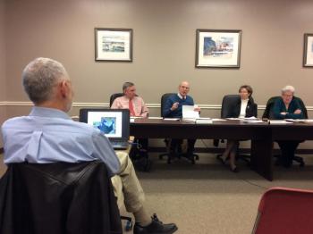 Bob Faunce, foreground, listens to the Boothbay Harbor selectmen’s concerns and questions about coastal flooding. From left are selectmen Russ Hoffman, Bill Hamblen, Denise Griffin and Wendy Wolf. KATRINA CLARK/Boothbay Register