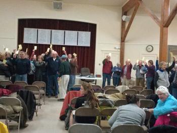 ““Yes votes near the kitchen and no votes near the piano.” Southport residents vote at town meeting. JANE CARPENTER/Boothbay Register