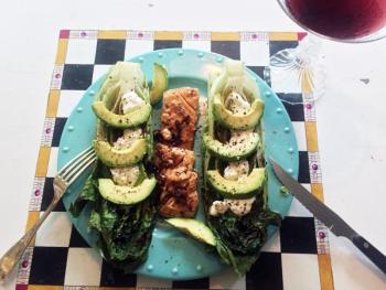 Another fancy dinner in Edgecomb: Grilled romaine with a creamy lemon dressing and avocodo slices, served with roasted salmon. SUZI THAYER/Boothbay Register