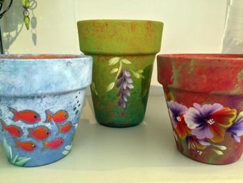 Hand-painted plant pots are available in the new flower shop in Wiscasset, Water Lily Flowers and Gifts. SUZI THAYER/Boothbay Register