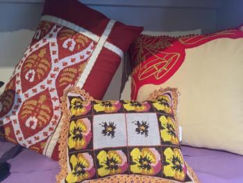 Hand-stitched pillows are available in the new flower shop in Wiscasset, Water Lily Flowers and Gifts. SUZI THAYER/Boothbay Register