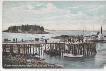 This color postcard of Negro Island from about 1905 shows Melvin Sawyer's fish weir in disrepair. There are brownish camps on the island tip, though readers may be unable to make them out. The image is an example of early photoshopping. The side-wheeler steamer Mt. Washington, built 1872, never left Lake Winnepasaukee in her 67-year career. Courtesy of Boothbay Region Historical Society