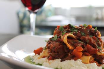 Slow-braised bolognese papardelle with fresh ricotta. Courtesy of Tony Bickford