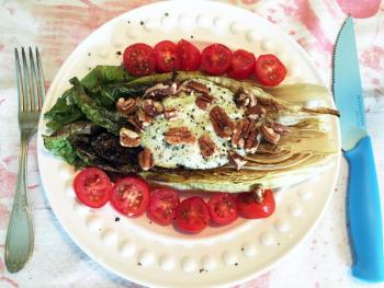 Grilled romaine lettuce can be served naked, or any way you please. Here it’s sitting pretty with grape tomatoes, a creamy lemon dressing and pecans. SUZI THAYER/Boothbay Register