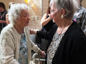 100-year-old Valerie Smith greets her 94-year-old sister, Josephine Zeles. SUZI THAYER/Boothbay Register