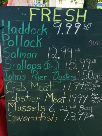One of Pemaquid Lobster & Seafood’s signs at the Boothbay Farmers’ Market on June 9. SUZI THAYER/Boothbay Register