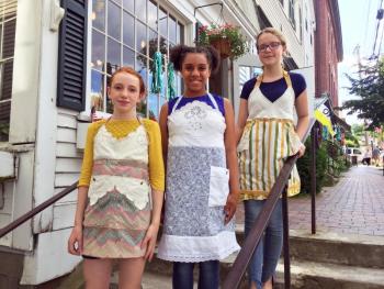 Madison Browne, left, Nylaina Wilson and Brooke Lindsay model aprons from Paper Doll Aprons. SUZI THAYER/Wiscasset Newspaper