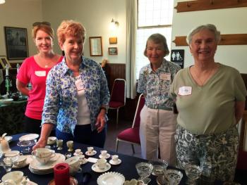 Cheryl Russell, left, Bea Walker, Liz Furber and Kathy Bugbee tend the treasures at the Southport United Methodist Church during the Southport Country Fair and Lobster Roll Luncheon on July 20. SUZI THAYER/Boothbay Register