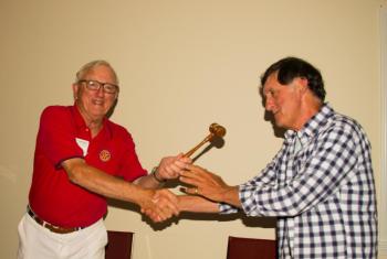 Tony Curulla receives the president’s gavel from Ham Meserve. Courtesy photo