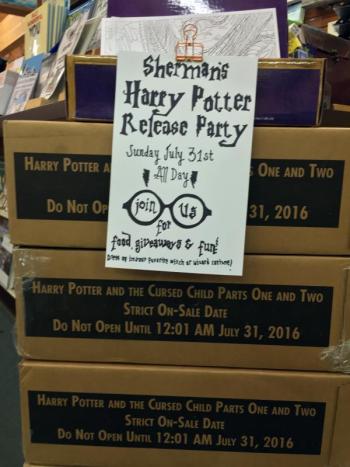 The pile of boxes in Sherman’s Books and Stationery with signs reading “Strict on-sale date – Do not open until 12:01 a.m. July 31, 2016” on each box. SUZI THAYER/Boothbay Register