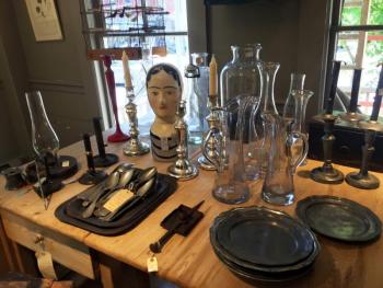 French pewter plates and French and Italian wine carafes sit on a Swedish table at the Marston House in Wiscasset. SUZI THAYER/Boothbay Register