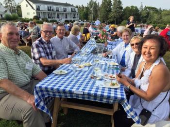 A group from here and away were just a few of the 120 people who attended the wine tasting and food pairing event on July 21. SUZI THAYER/Boothbay Register