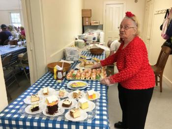 Ramona Gaudette serves up lobster rolls at the Southport Country Fair and Lobster Roll Luncheon on July 20. SUZI THAYER/Boothbay Register
