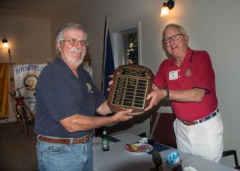 Mike Thompson, left, receives the President’s Award from outgoing club president Ham Meserve. Courtesy photo